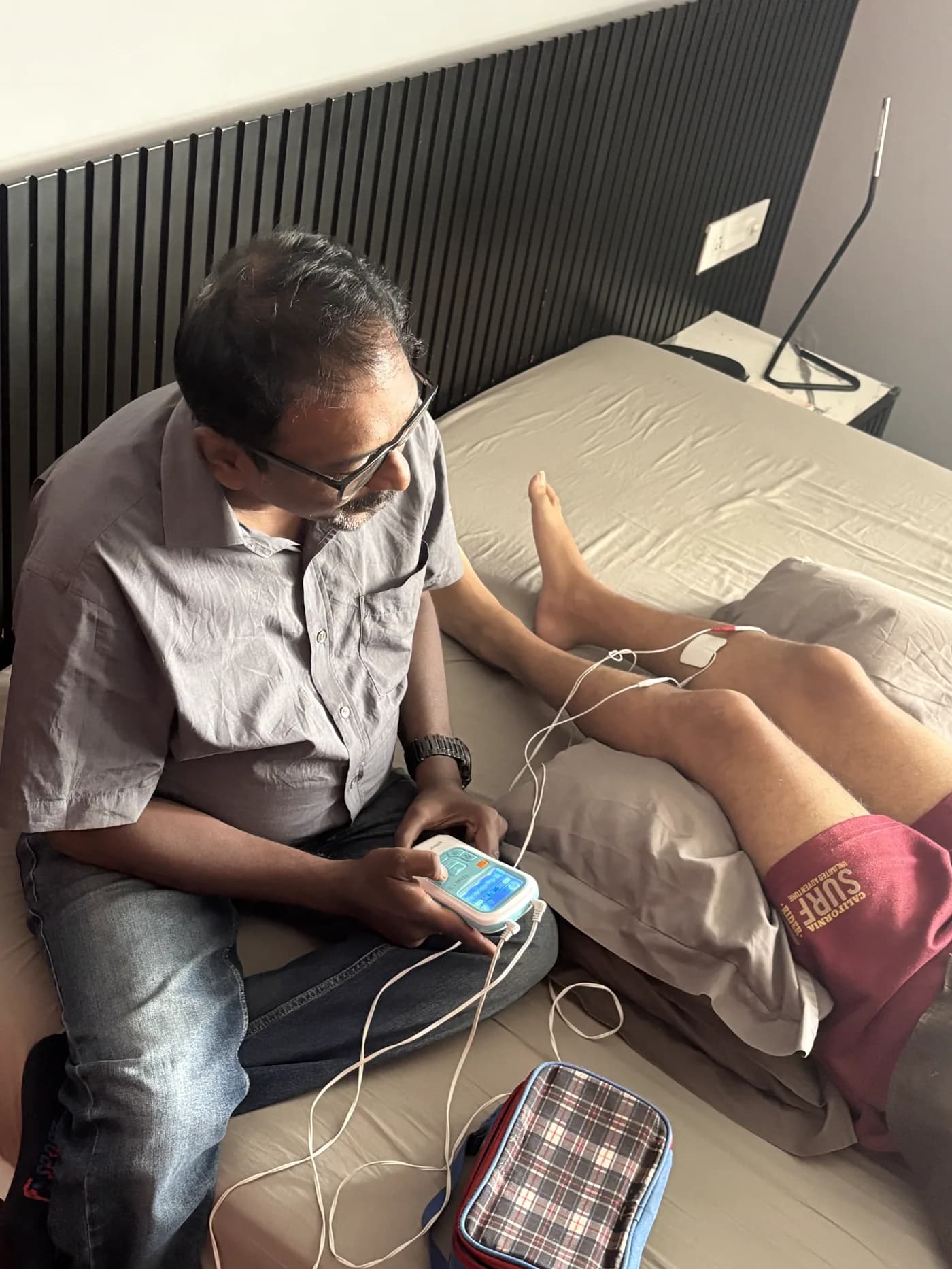 A Physova physiotherapist guiding a home treatment session